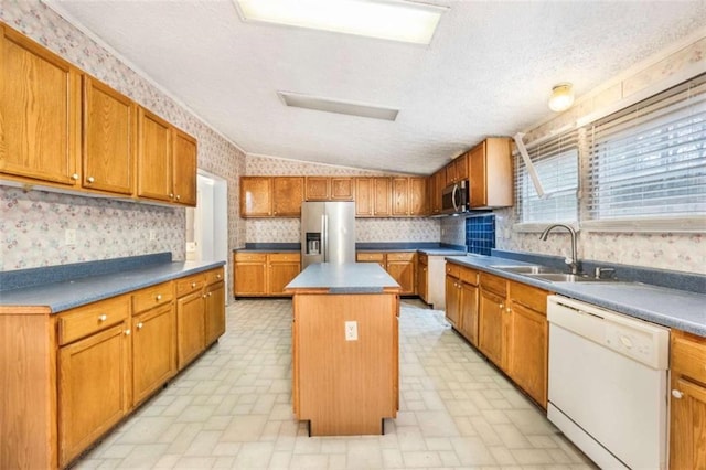 kitchen with brown cabinets, wallpapered walls, stainless steel appliances, and a center island