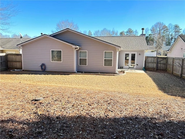 rear view of property featuring a patio area and french doors