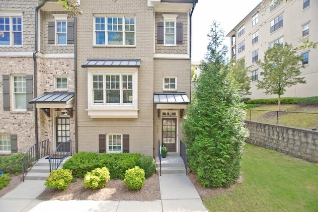 4000 Chastain Preserve Way NE, Atlanta, GA 30342 - townhome / multi-family property with a standing seam roof, brick siding, and metal roof