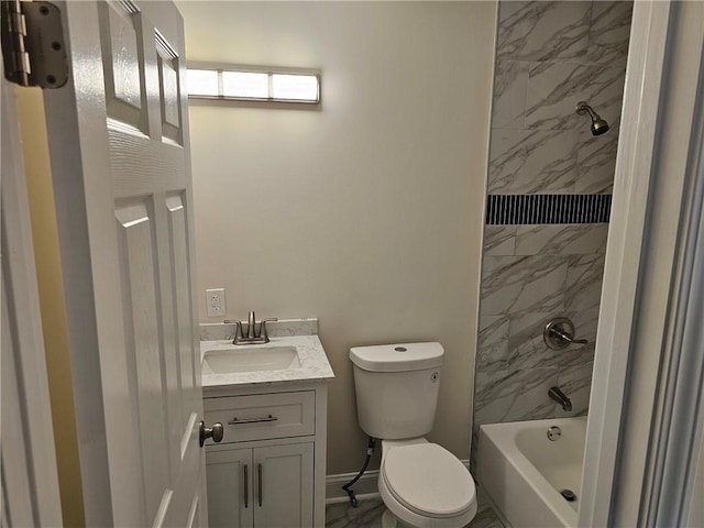 full bathroom with vanity, toilet, and tiled shower / bath