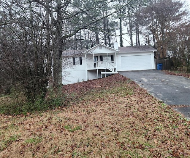 view of front of home featuring a garage and covered porch