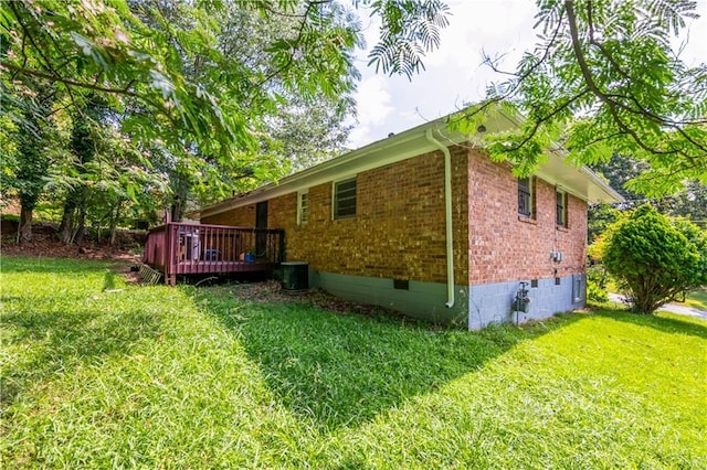 379 Utoy Cir SW, Atlanta, GA 30331 - view of side of property featuring crawl space, brick siding, a lawn, and a deck