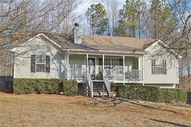 view of front facade with a porch and a front yard