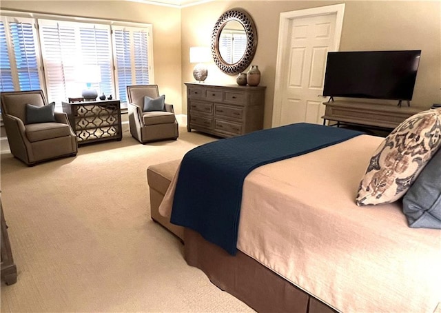 carpeted bedroom with crown molding