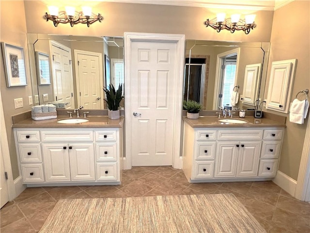 bathroom with a sink, two vanities, and tile patterned flooring