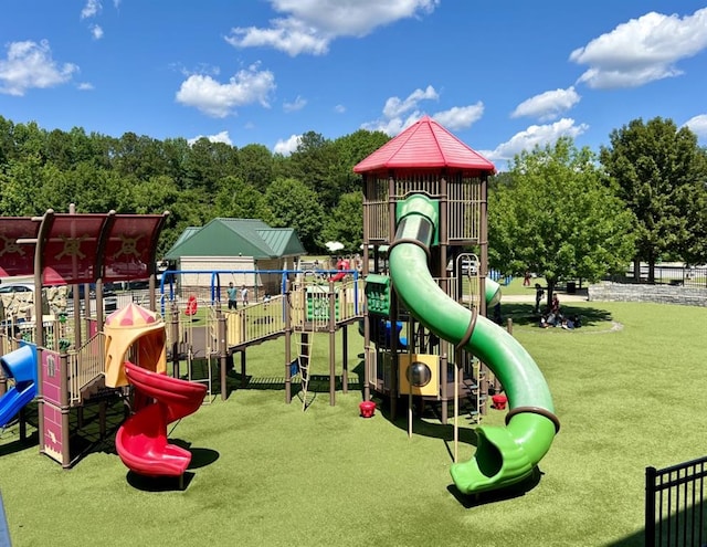 community playground featuring a lawn