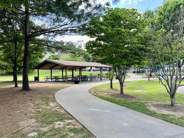 surrounding community with a gazebo and a lawn