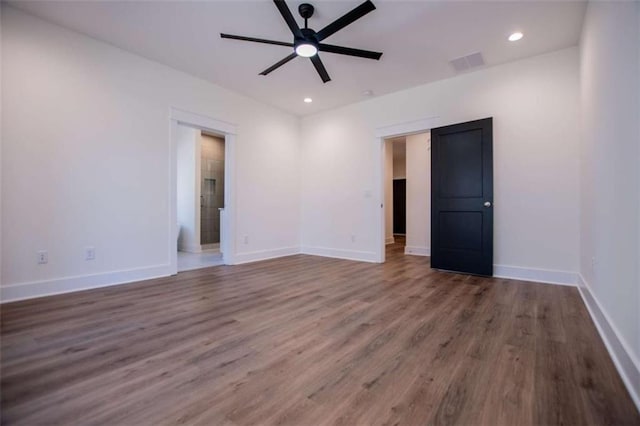 spare room with ceiling fan and hardwood / wood-style floors