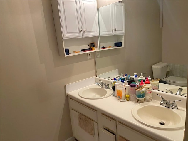 bathroom with toilet and vanity