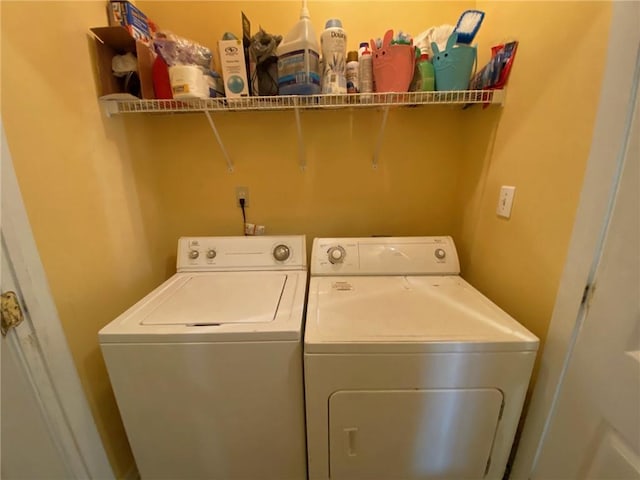 laundry area with independent washer and dryer