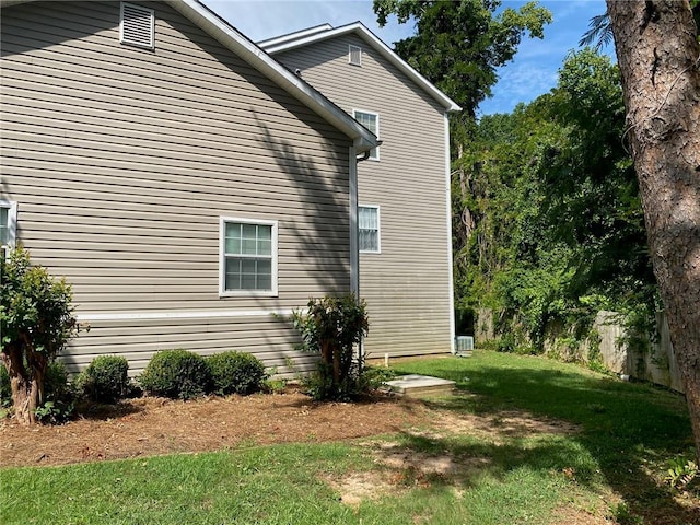 view of home's exterior featuring a yard