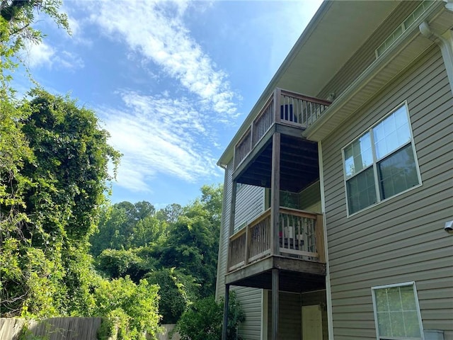 view of home's exterior with a balcony