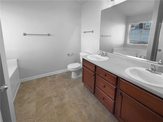 bathroom with a bath, double vanity, toilet, and a sink