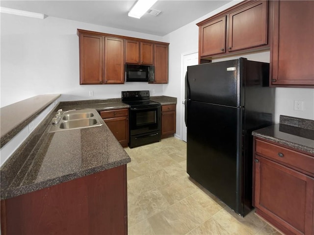 kitchen with black appliances, a sink, and visible vents