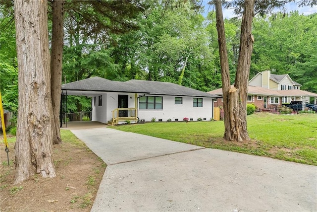 single story home featuring a carport and a front lawn