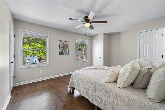 706 Twin Brooks Ct SE, Marietta, GA 30067 - bedroom with visible vents, multiple windows, baseboards, and wood finished floors