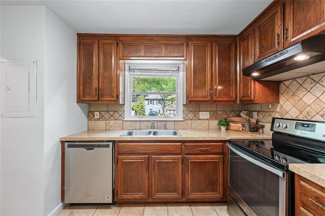 706 Twin Brooks Ct SE, Marietta, GA 30067 - kitchen featuring electric panel, a sink, light countertops, under cabinet range hood, and stainless steel appliances