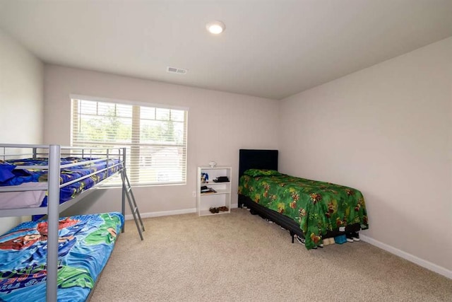bedroom with carpet floors and baseboards