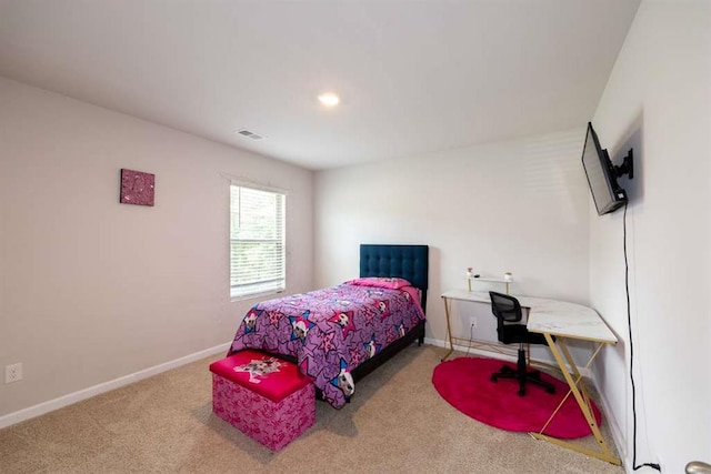 carpeted bedroom featuring baseboards