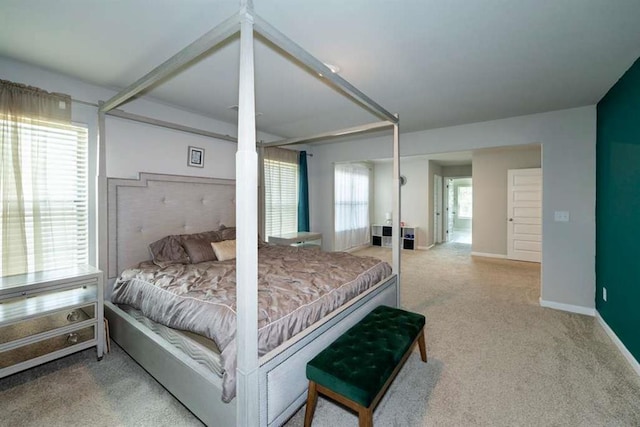 bedroom featuring carpet and baseboards