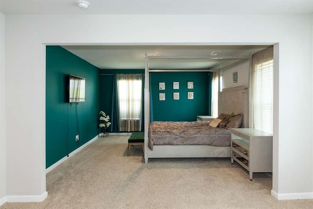 bedroom featuring carpet floors and baseboards