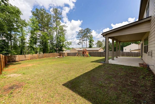 view of yard with a patio area and a playground