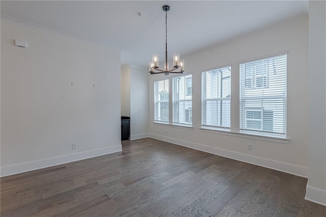 kitchen with ornamental molding, hardwood / wood-style floors, sink, and decorative light fixtures