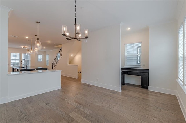 unfurnished office with plenty of natural light and light wood-type flooring