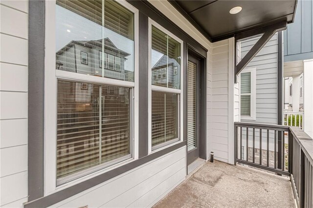 hallway with hardwood / wood-style flooring