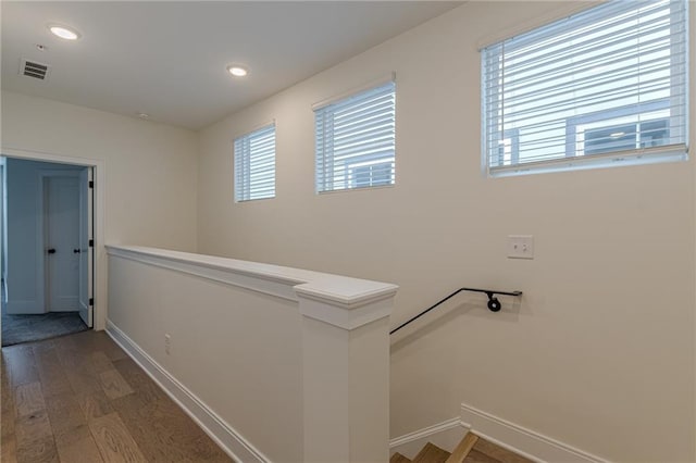 unfurnished room with dark colored carpet