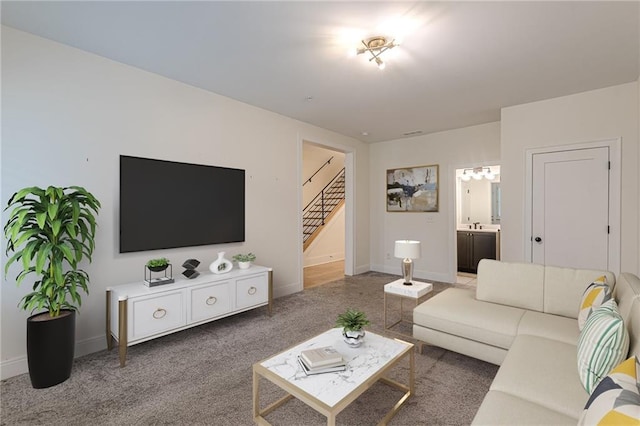 empty room featuring a tray ceiling, ceiling fan, and carpet floors