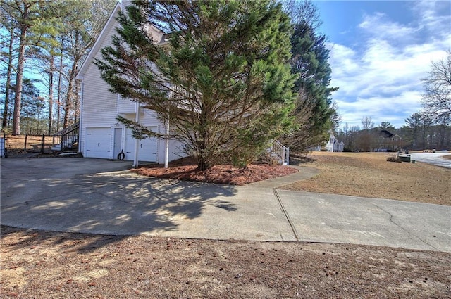 view of side of property with a garage