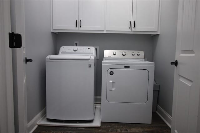223 Deans Dr, Dawsonville, GA 30534 - washroom featuring dark wood-style flooring, cabinet space, baseboards, and separate washer and dryer