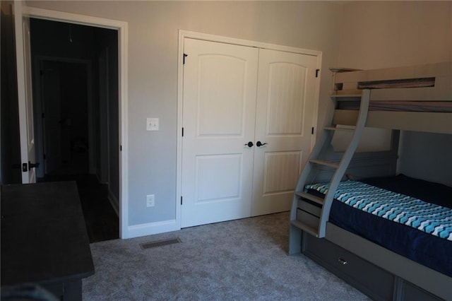 223 Deans Dr, Dawsonville, GA 30534 - bedroom with baseboards, visible vents, a closet, and carpet