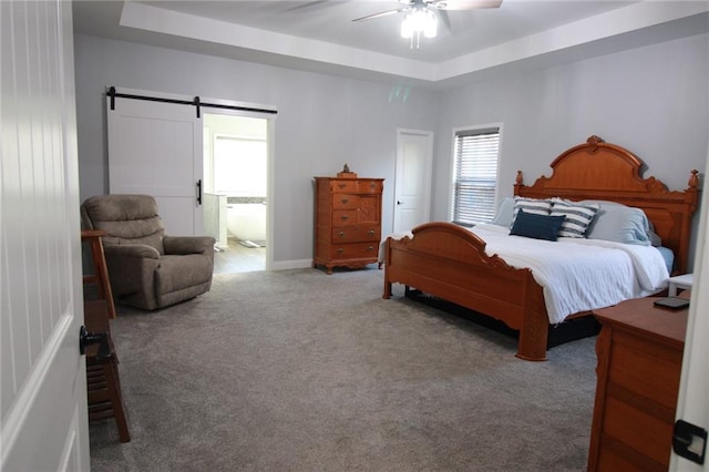 223 Deans Dr, Dawsonville, GA 30534 - bedroom featuring a barn door, ceiling fan, carpet, and a raised ceiling