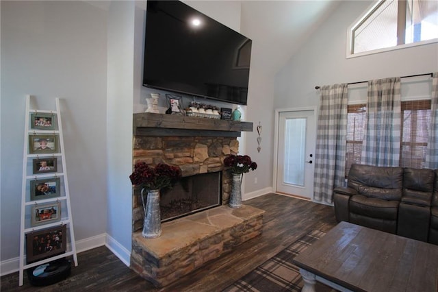 223 Deans Dr, Dawsonville, GA 30534 - living area featuring baseboards, lofted ceiling, wood finished floors, and a fireplace
