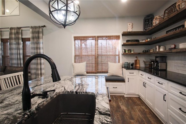 223 Deans Dr, Dawsonville, GA 30534 - kitchen featuring white cabinets, dark wood finished floors, dark stone countertops, a sink, and open shelves