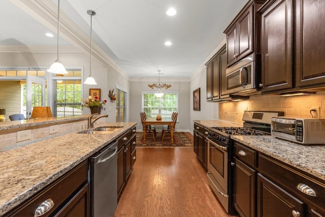 325 Rdg Hill Cir Unit 3, Marietta, GA 30064 - kitchen featuring appliances with stainless steel finishes, a sink, dark wood-style floors, light stone counters, and ornamental molding