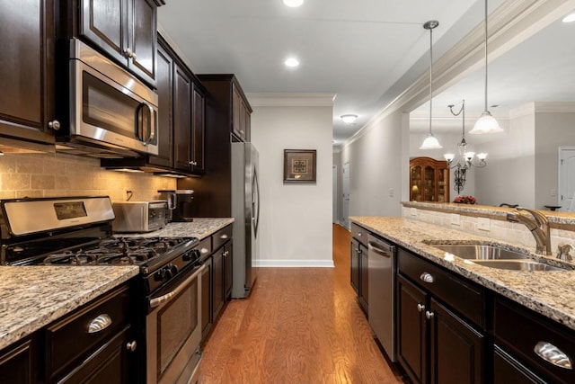325 Rdg Hill Cir Unit 3, Marietta, GA 30064 - kitchen with appliances with stainless steel finishes, a sink, crown molding, backsplash, and wood finished floors