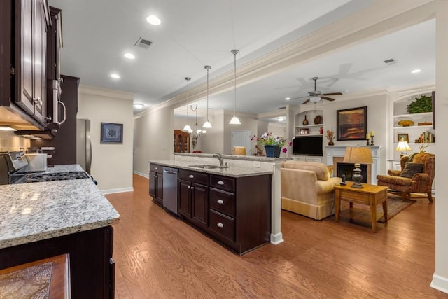 325 Rdg Hill Cir Unit 3, Marietta, GA 30064 - kitchen featuring a sink, crown molding, appliances with stainless steel finishes, dark brown cabinets, and wood finished floors