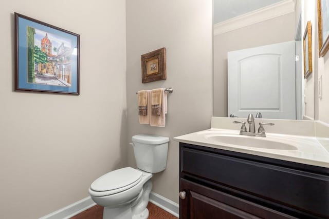 325 Rdg Hill Cir Unit 3, Marietta, GA 30064 - bathroom with baseboards, toilet, vanity, crown molding, and wood finished floors