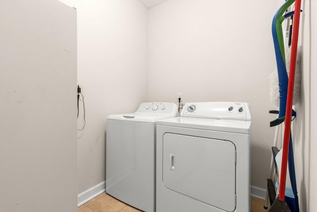 325 Rdg Hill Cir Unit 3, Marietta, GA 30064 - laundry room featuring washing machine and clothes dryer, baseboards, and light tile patterned floors
