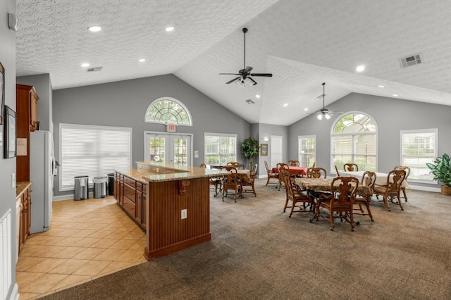325 Rdg Hill Cir Unit 3, Marietta, GA 30064 - kitchen featuring ceiling fan, freestanding refrigerator, light carpet, brown cabinets, and a textured ceiling