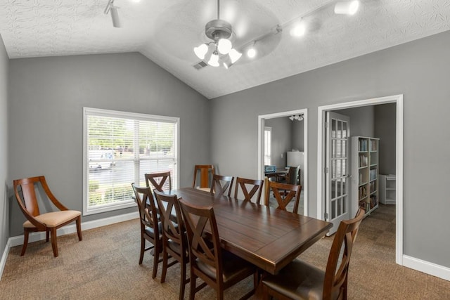 325 Rdg Hill Cir Unit 3, Marietta, GA 30064 - dining room featuring ceiling fan, carpet flooring, baseboards, track lighting, and lofted ceiling