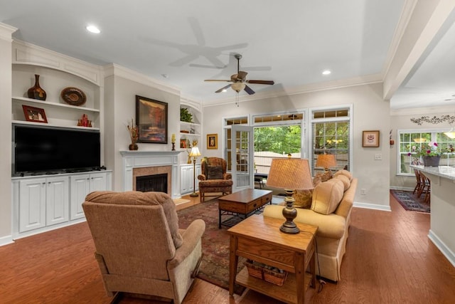 325 Rdg Hill Cir Unit 3, Marietta, GA 30064 - living room with crown molding, ceiling fan, plenty of natural light, a fireplace, and wood finished floors