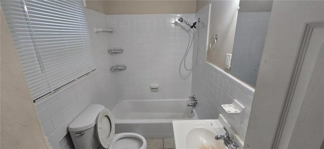 1516 Carter Rd, Decatur, GA 30032 - full bathroom with toilet, tile walls, tub / shower combination, and a sink