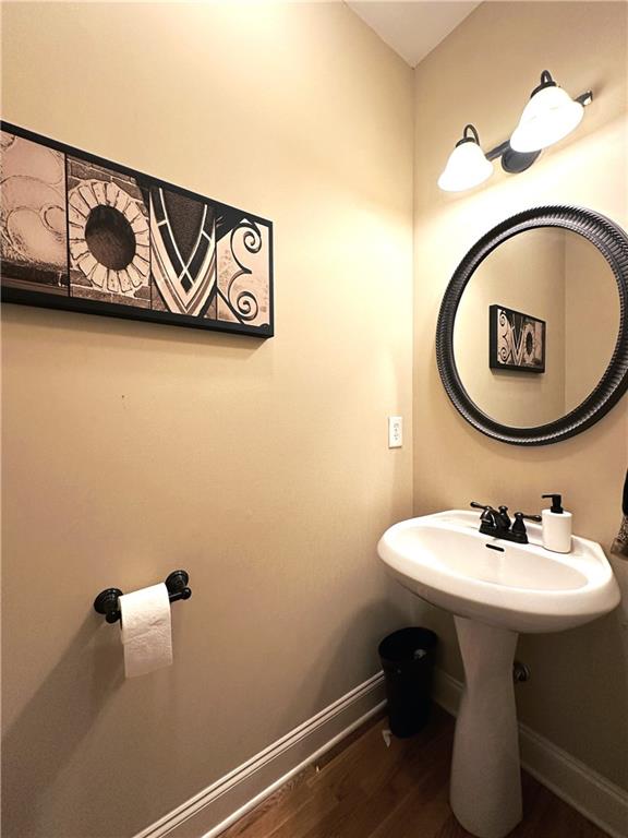 bathroom with hardwood / wood-style floors