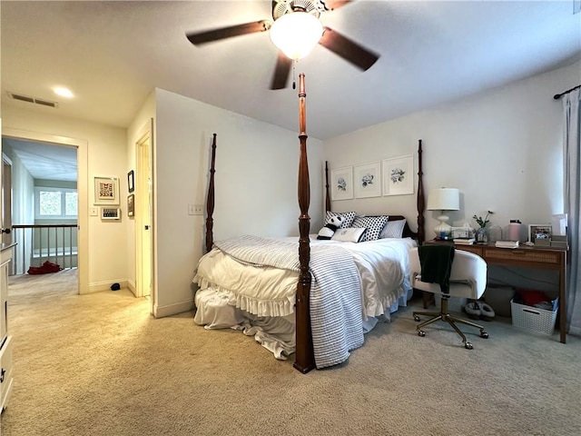 bedroom featuring light carpet and ceiling fan