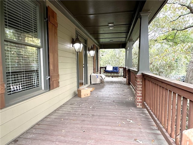 wooden terrace with a porch