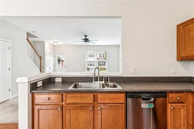 1049 Prestwyck Ct, Alpharetta, GA 30004 - kitchen featuring dishwasher, dark countertops, brown cabinetry, ceiling fan, and a peninsula